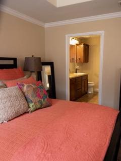 834 Salado Creek Ln, Georgetown, TX 78633 - bedroom featuring crown molding and ensuite bathroom