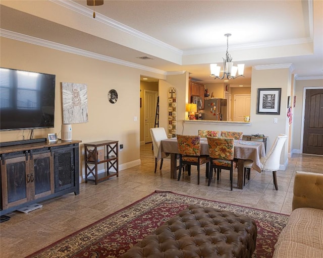 834 Salado Creek Ln, Georgetown, TX 78633 - dining area featuring a chandelier, baseboards, a tray ceiling, ornamental molding, and tile patterned flooring