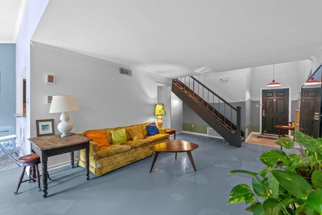 1605 Coronado Hills Dr Unit B, Austin, TX 78752 - living area with concrete flooring, stairway, and ornamental molding