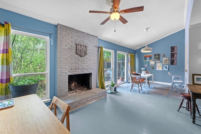 1605 Coronado Hills Dr Unit B, Austin, TX 78752 - living area featuring vaulted ceiling, healthy amount of natural light, ceiling fan, a fireplace, and baseboards