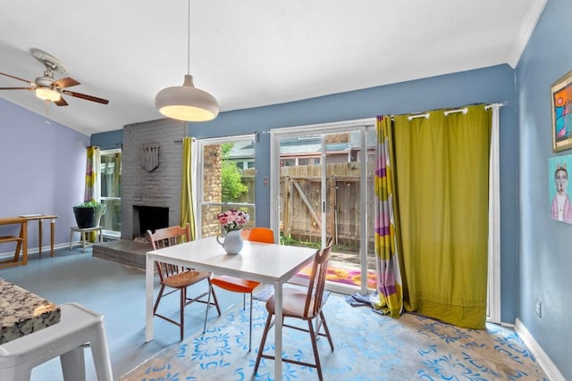 1605 Coronado Hills Dr Unit B, Austin, TX 78752 - dining area with a brick fireplace, baseboards, and a ceiling fan