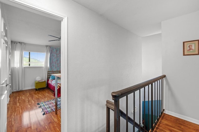 1605 Coronado Hills Dr Unit B, Austin, TX 78752 - corridor with wood finished floors and an upstairs landing