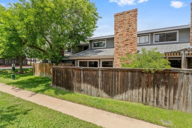 1605 Coronado Hills Dr Unit B, Austin, TX 78752 - back of property featuring a chimney