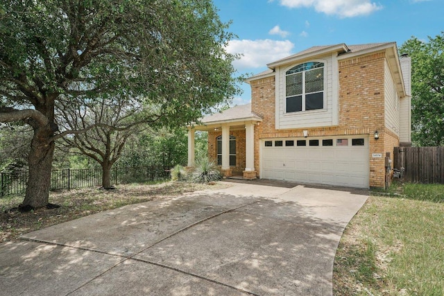 14104 Ballycastle Trl, Austin, TX 78717 - view of front of home featuring brick siding, a garage, driveway, and a chimney