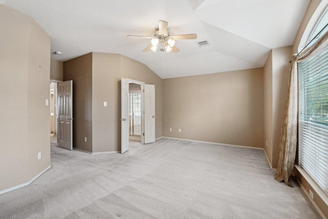 14104 Ballycastle Trl, Austin, TX 78717 - empty room featuring light carpet, ceiling fan, and lofted ceiling