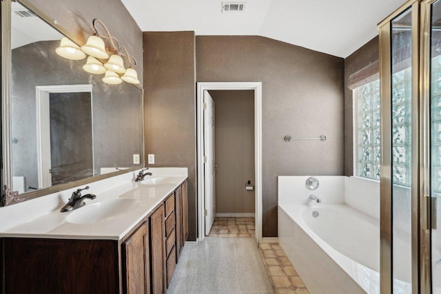 14104 Ballycastle Trl, Austin, TX 78717 - full bathroom featuring double vanity, a garden tub, vaulted ceiling, and a chandelier