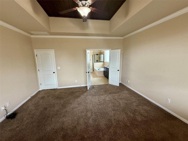 unfurnished bedroom with a tray ceiling, baseboards, carpet flooring, ensuite bathroom, and wood ceiling