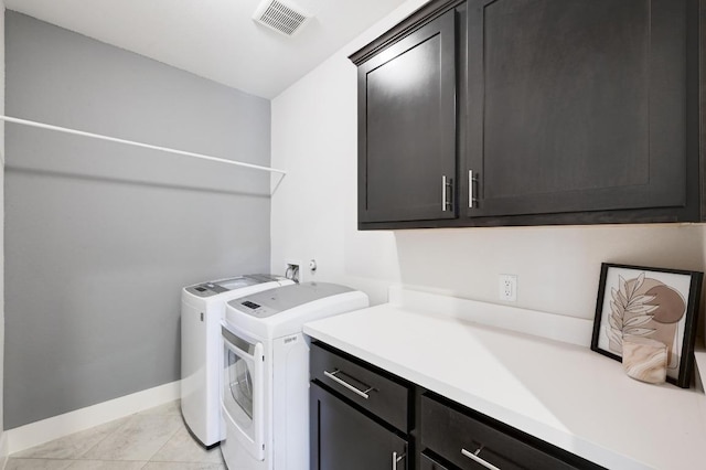 5303 Patagonia Pass, Austin, TX 78738 - laundry room featuring cabinet space, washing machine and clothes dryer, light tile patterned flooring, and baseboards