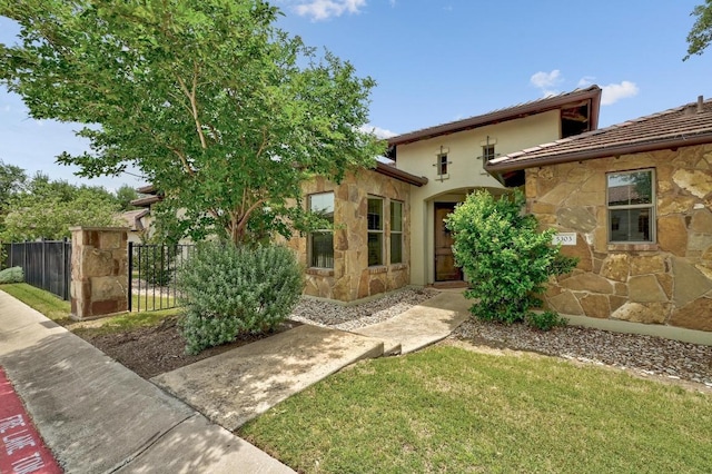 5303 Patagonia Pass, Austin, TX 78738 - view of front of property with stone siding and stucco siding