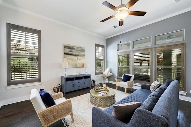 living room featuring baseboards, wood finished floors, ornamental molding, and a ceiling fan