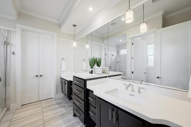 full bathroom featuring a shower stall, ornamental molding, vanity, and baseboards