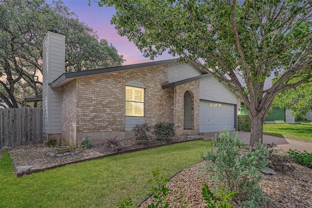 7815 Croftwood Dr, Austin, TX 78749 - view of front facade with driveway, a garage, a chimney, and brick siding