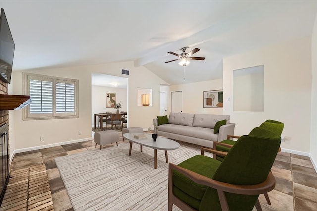 7815 Croftwood Dr, Austin, TX 78749 - living room featuring a fireplace, ceiling fan, baseboards, and stone tile floors