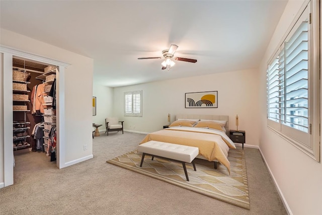 7815 Croftwood Dr, Austin, TX 78749 - carpeted bedroom with a walk in closet, baseboards, ceiling fan, and a closet