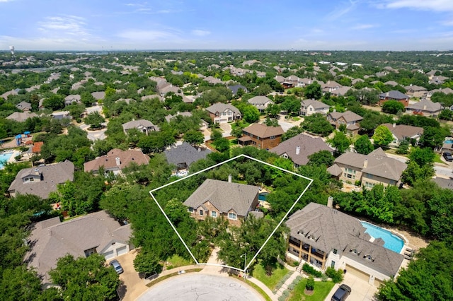 aerial view of residential area with a pool area and property parcel outlined