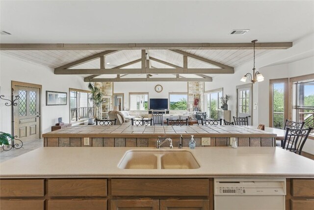 14415 Evergreen Cv, Austin, TX 78737 - kitchen with white dishwasher, a sink, open floor plan, pendant lighting, and wooden ceiling