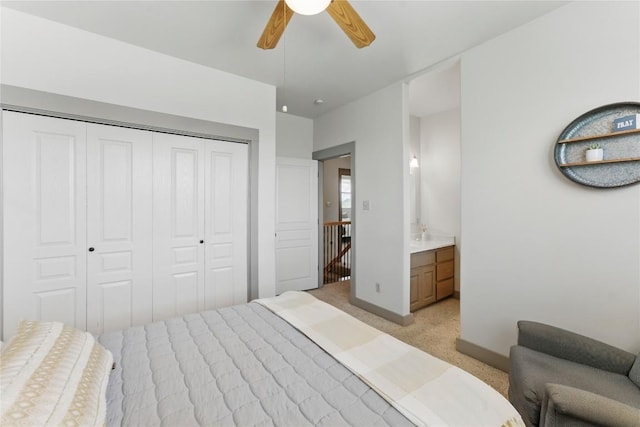 14415 Evergreen Cv, Austin, TX 78737 - bedroom featuring a closet, baseboards, light carpet, a ceiling fan, and ensuite bathroom