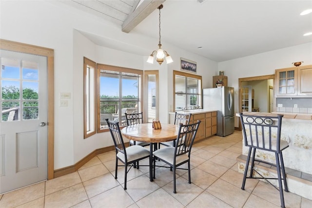 14415 Evergreen Cv, Austin, TX 78737 - dining room with plenty of natural light, light tile patterned floors, beam ceiling, baseboards, and a chandelier