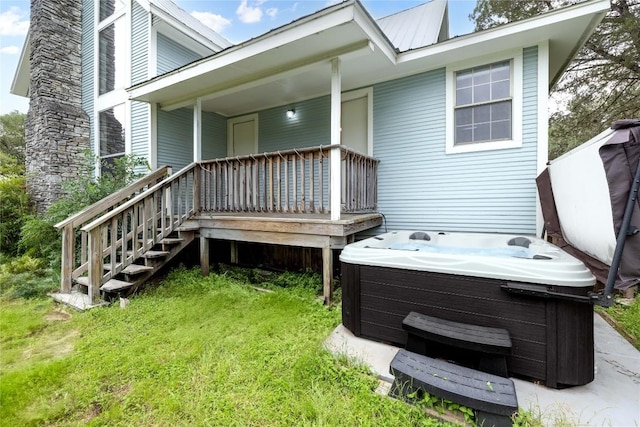 28920 Country Dr, New Braunfels, TX 78132 - back of property with a hot tub, metal roof, and covered porch