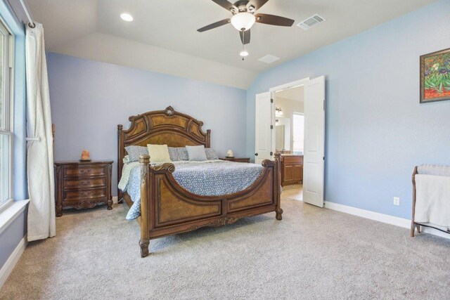 139 Kellogg Ln, Bastrop, TX 78602 - bedroom with lofted ceiling, baseboards, light colored carpet, ensuite bathroom, and ceiling fan
