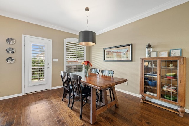 313 Monahans Dr, Georgetown, TX 78628 - dining area featuring ornamental molding and dark wood-style floors