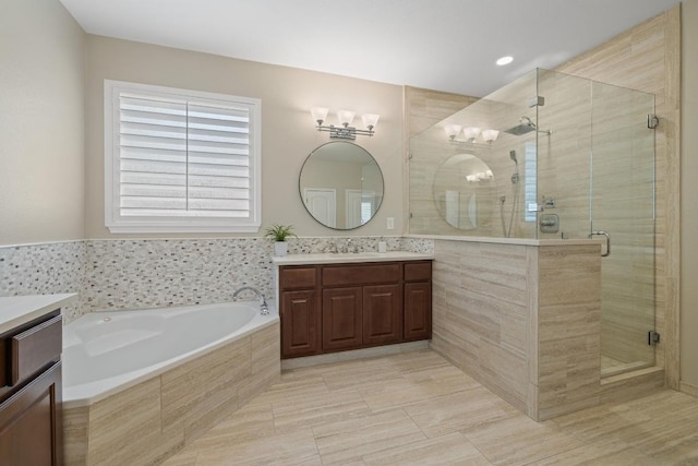 313 Monahans Dr, Georgetown, TX 78628 - bathroom featuring a stall shower, a garden tub, vanity, and recessed lighting