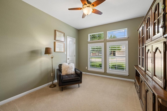 313 Monahans Dr, Georgetown, TX 78628 - sitting room featuring ceiling fan, light carpet, and baseboards