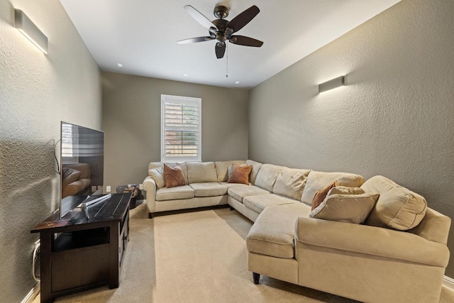 313 Monahans Dr, Georgetown, TX 78628 - living room with a ceiling fan, a textured wall, and light carpet