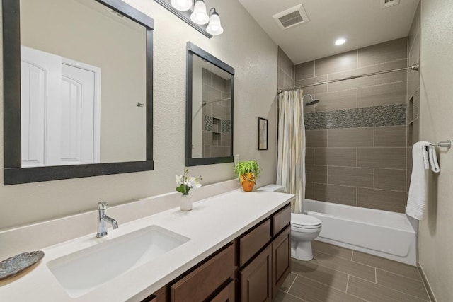 313 Monahans Dr, Georgetown, TX 78628 - bathroom featuring vanity, toilet, and shower / tub combo with curtain