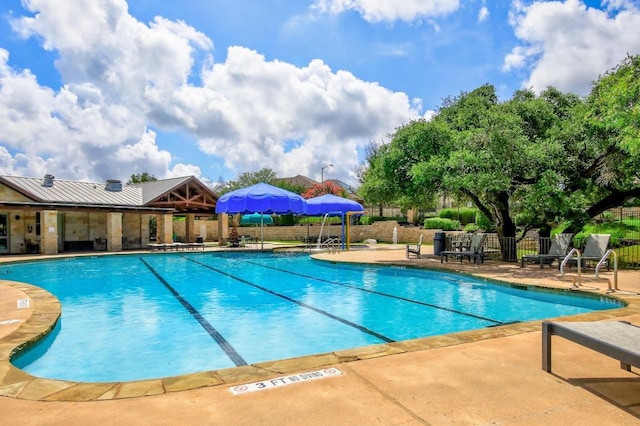 313 Monahans Dr, Georgetown, TX 78628 - community pool featuring a patio area and fence