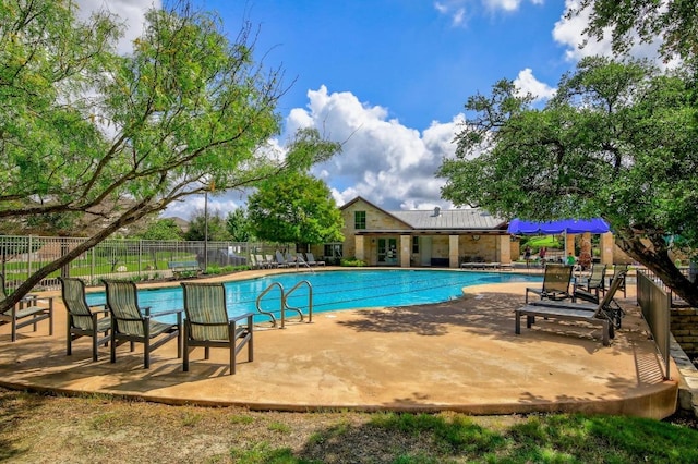 313 Monahans Dr, Georgetown, TX 78628 - community pool featuring fence and a patio