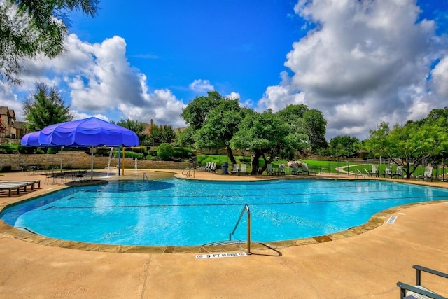 313 Monahans Dr, Georgetown, TX 78628 - community pool with fence and a patio