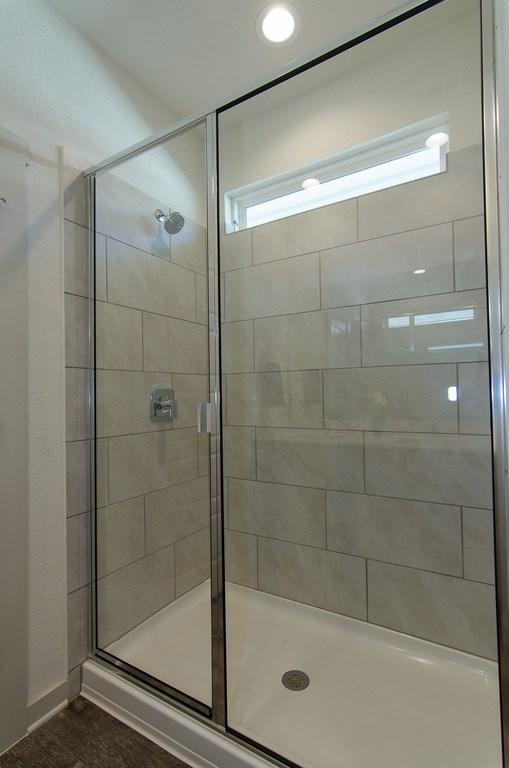 217 Deserti Rd, Leander, TX 78641 - full bathroom with a shower stall