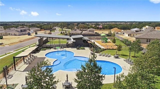 217 Deserti Rd, Leander, TX 78641 - community pool with a residential view and a patio area