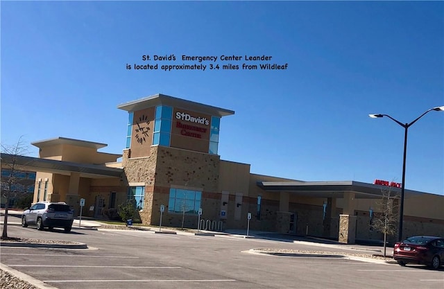 217 Deserti Rd, Leander, TX 78641 - view of building exterior featuring uncovered parking