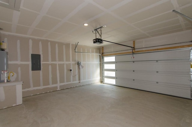 217 Deserti Rd, Leander, TX 78641 - garage featuring electric panel, a garage door opener, gas water heater, and recessed lighting