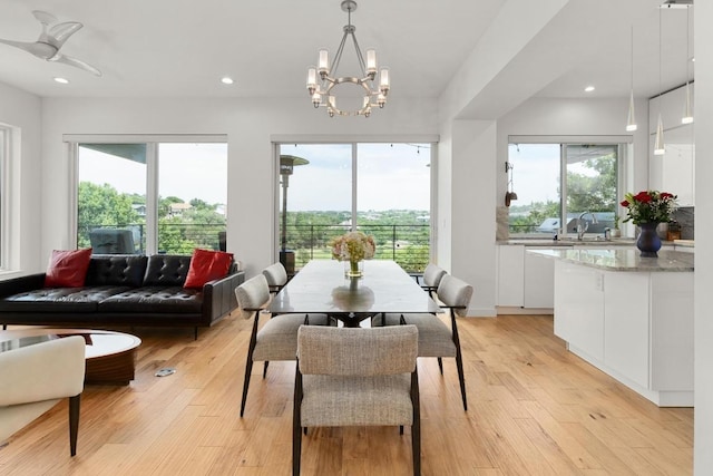 5728 Misty Hill Cv, Austin, TX 78759 - dining space featuring plenty of natural light, light wood-style flooring, a chandelier, and recessed lighting