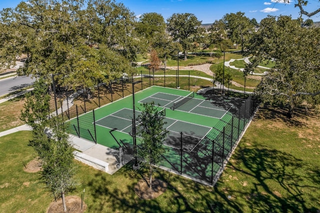 108 Nandina Path, Bastrop, TX 78602 - view of basketball court featuring a tennis court and view of wooded area