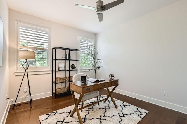 office space with baseboards, ceiling fan, and wood finished floors