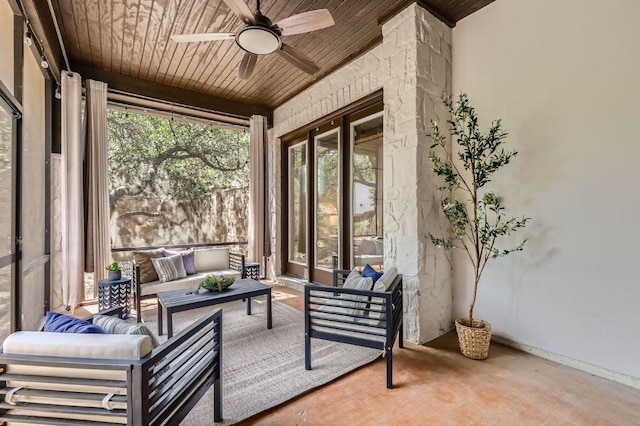 view of patio with ceiling fan and an outdoor living space