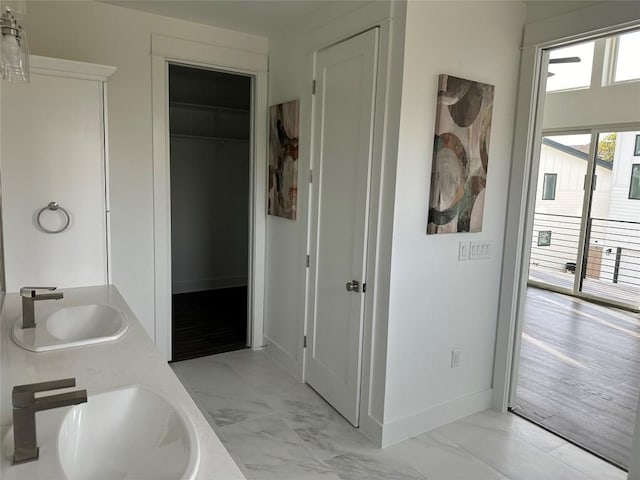 2111 Prather Ln Unit 1, Austin, TX 78704 - full bath with marble finish flooring, baseboards, and double vanity