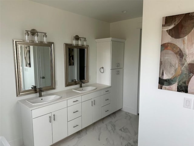 2111 Prather Ln Unit 1, Austin, TX 78704 - bathroom with marble look tile flooring, double vanity, and baseboards