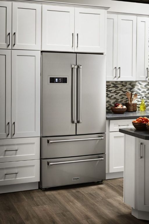 2111 Prather Ln Unit 1, Austin, TX 78704 - kitchen with high end refrigerator, dark countertops, dark wood-style floors, white cabinetry, and decorative backsplash