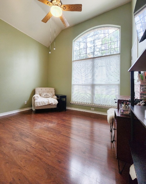 149 Mcallister Rd, Bastrop, TX 78602 - living area with ceiling fan, vaulted ceiling, wood finished floors, and baseboards