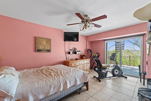 909 Redbud Trl, West Lake Hills, TX 78746 - bedroom with access to outside, light tile patterned floors, a ceiling fan, and a textured ceiling