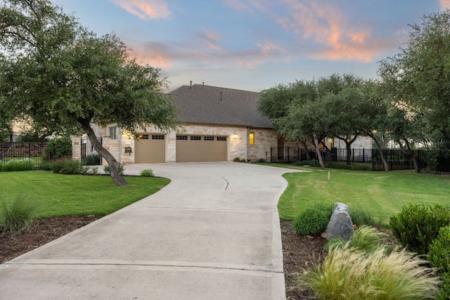 2761 Fishing Hole Cv, Leander, TX 78641 - view of front of property featuring an attached garage, driveway, and stone siding