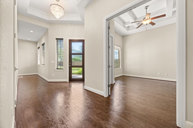 2761 Fishing Hole Cv, Leander, TX 78641 - foyer entrance with a tray ceiling, wood finished floors, a ceiling fan, a chandelier, and ornamental molding