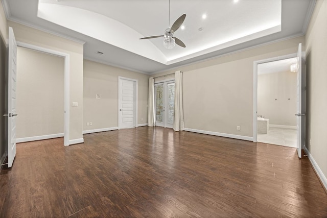 2761 Fishing Hole Cv, Leander, TX 78641 - unfurnished bedroom with wood finished floors, crown molding, vaulted ceiling, a raised ceiling, and ceiling fan
