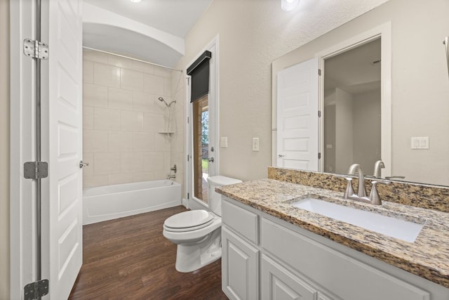 2761 Fishing Hole Cv, Leander, TX 78641 - full bath featuring wood finished floors, vanity, and bathtub / shower combination