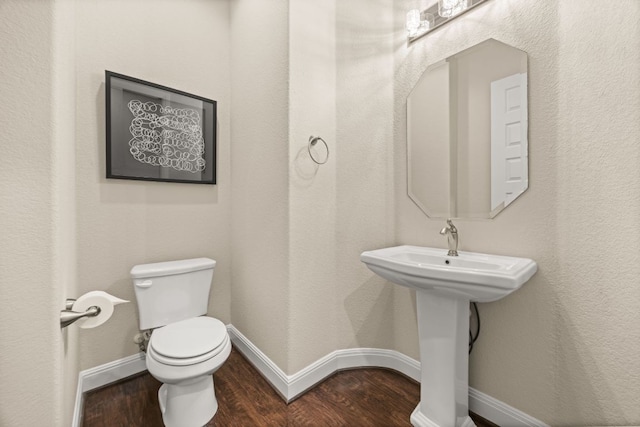2761 Fishing Hole Cv, Leander, TX 78641 - half bathroom featuring toilet and wood finished floors